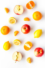 Colorful summer fruits background on white table top view