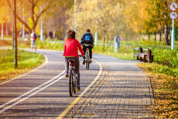 Cyclist ride on the bike path in the city Park
