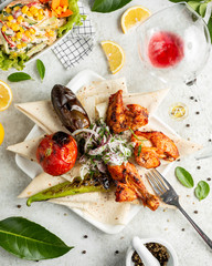 chicken kebab served with grilled vegetables