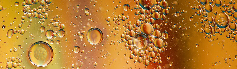 oil with bubbles on on dark blue background. Abstract background.
