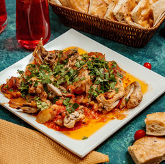 chicken sauce with vegetables, potatoes sprinkled with herbs