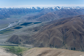 dirt road on edge of barren ridge at Diadem Range, near Quailburn, New Zealand