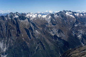Patriarch peak range dark slopes on High Burn valley, from above, New Zealand