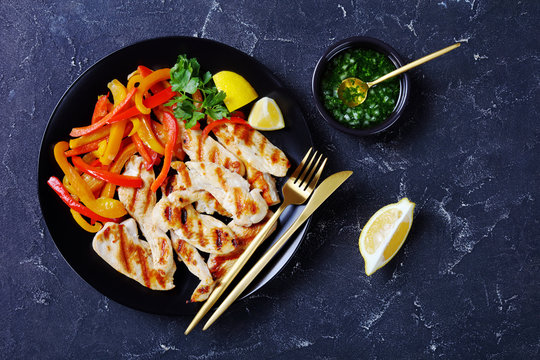 Grilled chicken tenders with peppers, top view