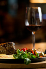 Beef steak with mashed potatoes and grilled vegetables