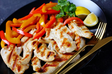 Close-up on the plate grilled chicken breast piece