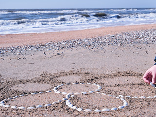 Drawing on a sandy beach.