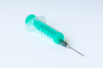 Disposable medical syringes on a white background