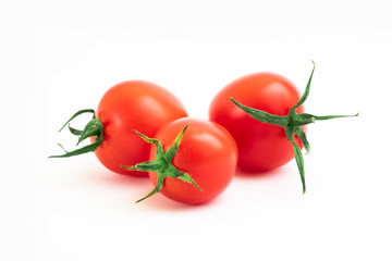Fresh tomatoes with leaves on a white background. Tomatoes with full depth of coldness