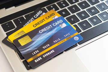 Credit card on a computer keyboard. internet purchase concept