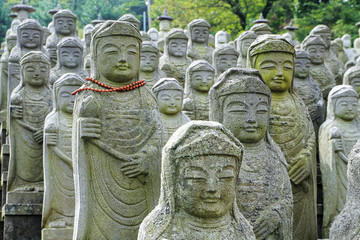 Buddha statues standing in line