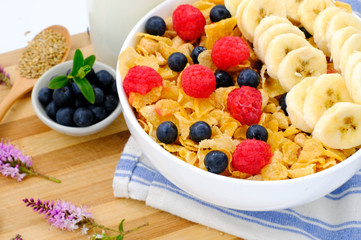 cereal in a white bowl on wooden background. Healthy breakfast concept.