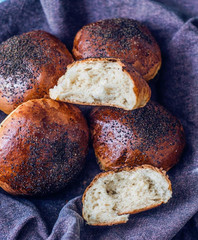 homemade buns with poppy on purple