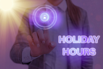 Writing note showing Holiday Hours. Business concept for employee receives twice their normal pay...