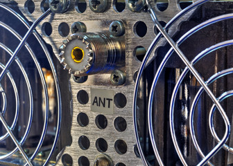 Rear panel of a high frequency power amplifier with vacuum tubes close up view