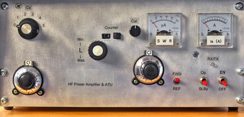 Front panel of a high frequency power amplifier with vacuum tubes close up view