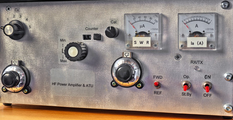 Front panel of a high frequency power amplifier with vacuum tubes close up view