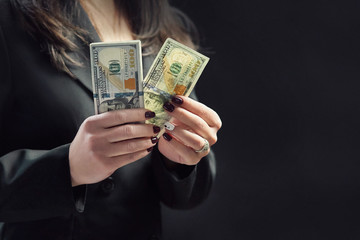 dollars in hands, female hands consider a bundle of money, the concept of having money
