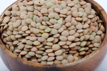 dry green lentils in bowl