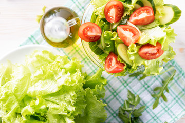 vegetable salad on the table. Tomatoes and cucumbers are cut into slices.