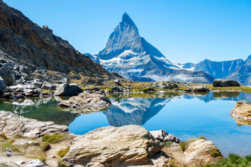 picturesque landscape with wild nature and glacial lake in the Pennine Alps, in the background peak...