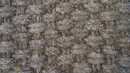 Texture of weaving made of natural brown rope. fleecy geometric texture. way of weaving threads