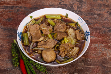 Thai style soup with meat and mushrooms