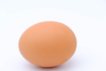 Close-up view of raw chicken eggs on white background