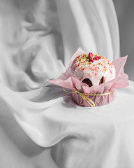 Easter cake with flowers on the white fabrick background 