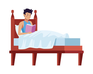 young man reading book in bed