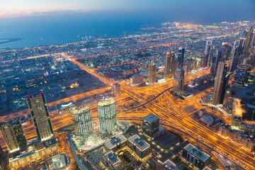 Dubai night city skyline with modern skycrapers, UAE