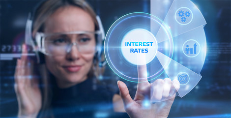 Businessman presses button  interest rates on virtual screens. Business, Technology, Internet and...
