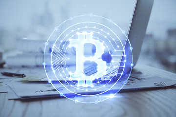 Multi exposure of blockchain and crypto economy theme hologram and table with computer background....