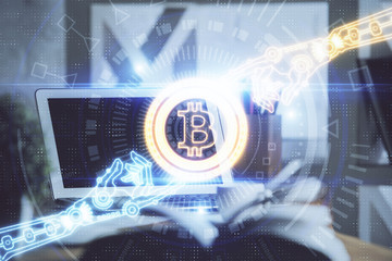 Multi exposure of blockchain and crypto economy theme hologram and table with computer background....