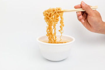 Instant cup ramen on white background