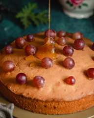 pie decorated with grapes and honey