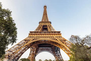 Gordijnen Eiffel tower against blue sky. Wide angle shot from below. Paris, France.  © Telly