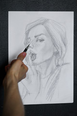 Sketch drawing sketch of a girl showing the middle finger and licking it.