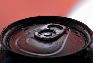 Close-up of soda can with focus on opening seal