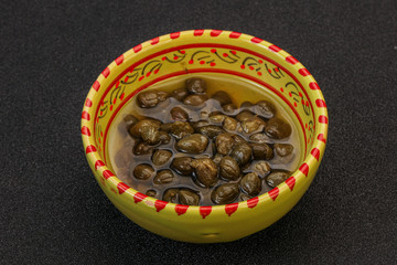Tasty capers in the bowl