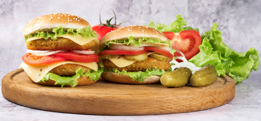 .burgers on the kitchen board on a gray background
