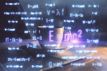 Desktop computer background and formula hologram writing. Double exposure. Education concept.