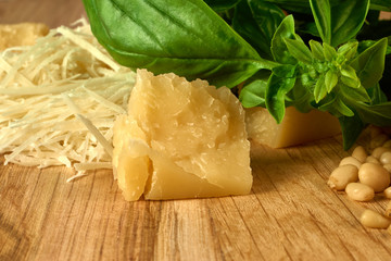 Ingredients for pesto sauce on wooden background