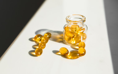 The number 19  out of cod liver capsules isolated on table. Omega-3