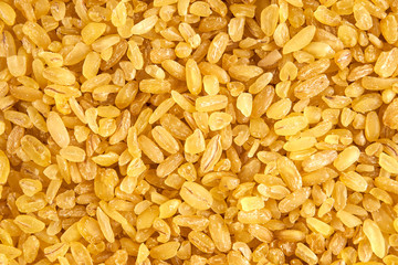 Raw dry bulgur groats ready for cooking