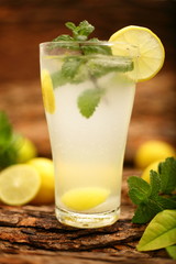 mojito cocktail with lime and mint on a sunny day