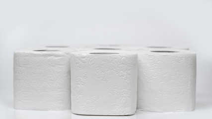 Rolls of toilet paper on a white background. Outbreak of the coronavirus concept COVID-19. Coronavirus - 2019-nKoV. Stay at home while in quarantine.