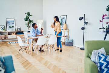 Black couple sharing ideas at home