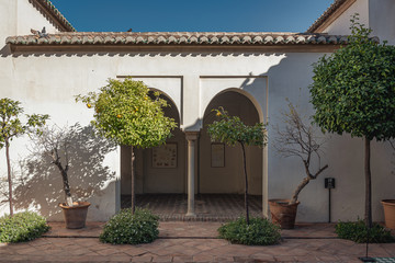 Alcazaba interior courtyard with covered walkway in Malaga.