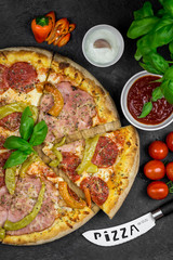 pizza with salami, prosciutto and pepperoni